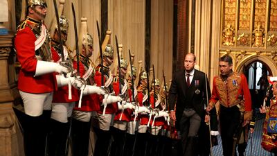 Prince William walks past the The Household Cavalry at the Palace of Westminster.