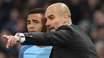 Manchester City's manager Pep Guardiola gives instructions to Manchester City's Brazilian striker Gabriel Jesus before he come on to make his debut in January. Paul Ellis / AFP