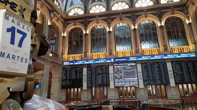 Screens show the performance of Spain's Ibex index on March 17 at the stock market in Madrid. Market operator BME's board accepted a €2.8bn offer from Swiss bourse SIX. EPA