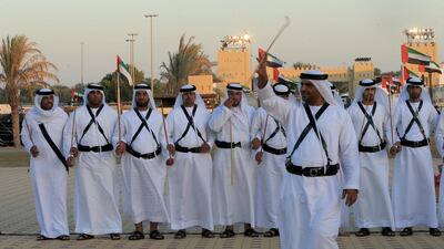 Men perform a Yawalah traditional dance. Ravindranath K / The National