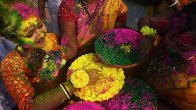 Indian students celebrate Holi festival in Kolkata. Dibyangshu Sarkar / AFP Photo
