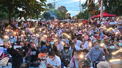 Anti-government protesters take part in a pro-democracy rally outside Thailand's parliament in Bangkok on 24 September, to demand a new constitution. Mladen Antonov / AFP