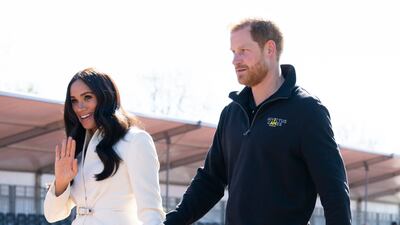 Meghan, joined by the Duke of Sussex, attends the track and field event at the Invictus Games wearing an Ivory belted Brandon Maxwell blazer, jeans and nude suede heels. AP