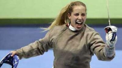 Mariel Zagunis of the USA celebrates after she defeated Azerbaijan's Elena Jamayeva in the women's fencing individual sabre competition at the Athens 2004 Olympic games.