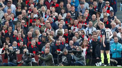 Manchester City's Kevin De Bruyne and Manchester City fans during the match. Reuters