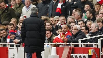 Chelsea manager Jose Mourinho speaks to Arsenal fans. Reuters