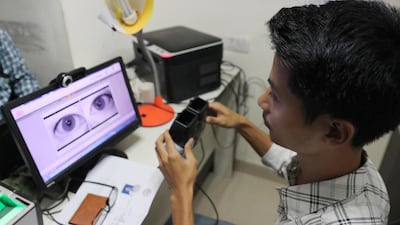 An Indian boy having his retinas scanned for his digital ID card under the Aadhaar scheme.Rajat Gupta/ EPA