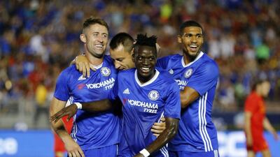 Gary Cahill, left, is congratulated by his Chelsea teammates after scoring against Liverpool. Mike Blake / Reuters