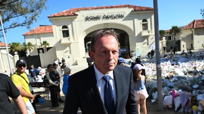 Former Australian prime minister Tony Abbott visits a memorial to people killed at a Hannukah celebration on Bondi Beach in Sydney on December 14. EPA