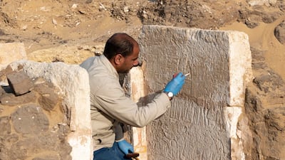 Egyptian conservator Hassan Soliman, who works for the Supreme Council of Antiquities in the Saqqara archaeological area, works to restore the fragile limestone in the small funerary chapel of Yuyu. Photo: Ministry of Tourism and Antiquities Facebook