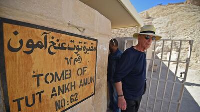 A man exits from the restored underground tomb. AFP