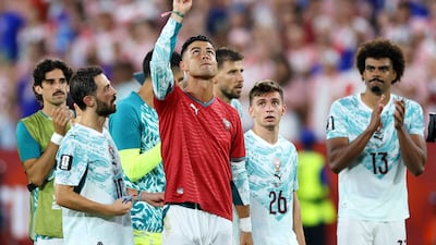 Cristiano Ronaldo wears Diogo Jota's No 21 shirt after Portugal's win over Croatia in Toronto. Getty Images