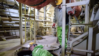 Workers below the decks of an under-construction Maersk triple-E class container ship. Ed Jones / AFP