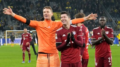 Bayern's goalkeeper Manuel Neuer and Robert Lewandowski celebrate at the end of the match. AP Photo