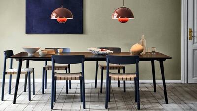 Pendants over the dining table help segregate the space. Courtesy Design Shanghai