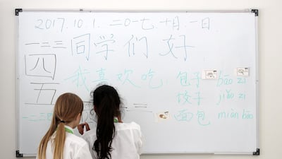 Pupils study Chinese characters at Hartland International School in in Dubai. Dozens of government schools will be trialling language classes with the help of 150 Chinese teachers in the 2019-2020 academic year. Pawan Singh / The National