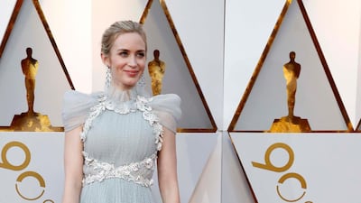 NEUTRAL TONES: Emily Blunt looked ethereal in Schiaparelli Haute Couture, with a high neckline, and ruched cap sleeves. The almost transluscent ash-blue colour was finished with lace detailing. Reuters
