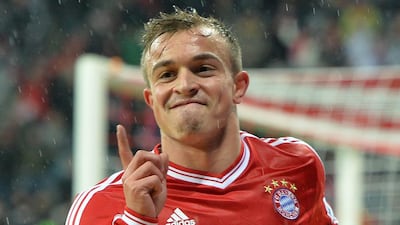 Xherdan Shaqiri reacts after scoring Bayern's third goal in a victory over Hamburg on Saturday. Kerstin Joensson / AP