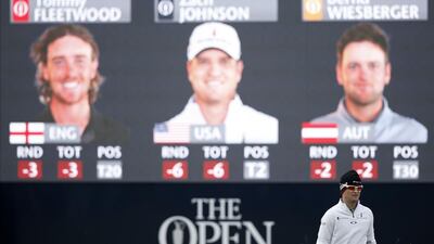 US golfer Zach Johnson walks onto the 16th tee during his first round 6-under performance to tie for second in the opening round of the 2015 Open Championship on Thursday. Adrian Dennis / AFP