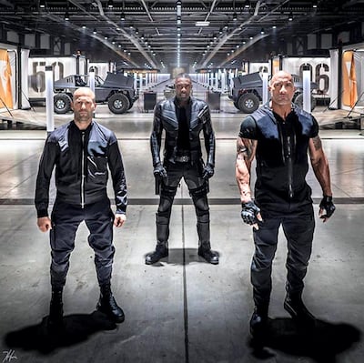 Jason Statham, Idris Elba, and Dwayne Johnson in 'Fast & Furious Presents: Hobbs & Shaw', which is due to be released in August 2019. Courtesy Universal Pictures