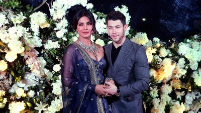 Priyanka wore a navy lehenga while Jonas wore a grey suit (AP Photo/Rajanish Kakade)