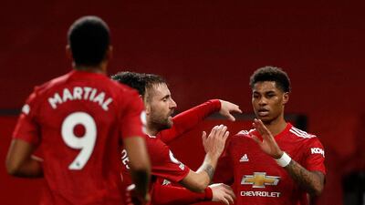 Manchester United striker Marcus Rashford (R) celebrates scoring the opening goal during their 3-1 win in Newcastle's last Premier League match. AFP