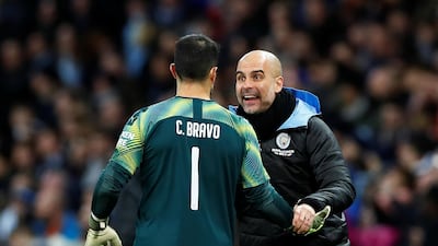 Manchester City manager Pep Guardiola with Claudio Bravo Action. Reuters