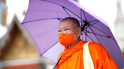 A monk wears a face mask in Bangkok. Thailand has reported two cluster outbreaks of Covid this year. EPA