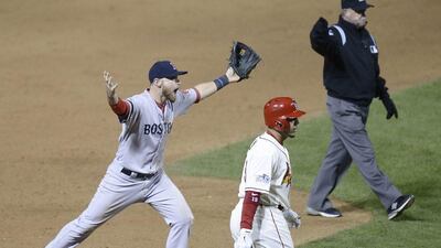 Jim Joyce, right, made the obstruction call that awarded St Louis the winning run on Saturday night. Tannen Maury / EPA