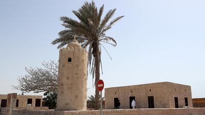 Made from rocks, coral and mud pulled from the sea, Al Aqroubi Mosque stands some 30 metres away from its minaret. Pawan Singh / The National