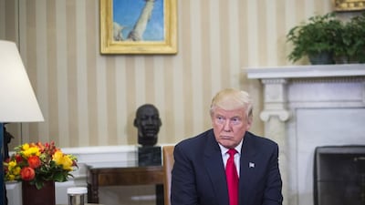President-elect Donald Trump listens as president Barack Obama talks to the media in the Oval Office of the White House. Jabin Botsford / Getty Images