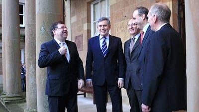 Irish prime minister Brian Cowen, left, and Britain's prime minister Gordon Brown, second left, are greeted by the secretary of state for Northern Ireland ,Shawn Woodward, third right, Irish foreign affairs minster Michael Martin, second right, and Northern Ireland security minister Paul Goggins, right, at Hillsborough Castle in Northern Ireland, on February 5, 2010.
