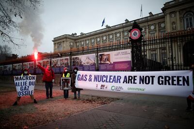 Activists protest against France's support for nuclear energy at a protest in Paris criticising President Emmanuel Macron. Reuters