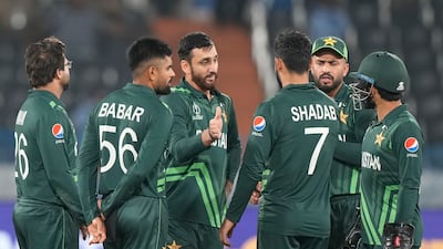 Pakistan's Agha Salman, centre, celebrates the wicket of New Zealand's Rachin Ravindra during their World Cup warm-up match in Hyderabad. AP