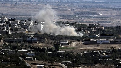 Smoke rises from the village of Jubata Al Kashab on the Syrian side of the border with Israel, in the Golan Heights, during the fight between Syrian government forces and militants groups. Russian president Vladimir Putin is expected to explain to world leaders during the UN General Assembly in New York about his intentions in Syria as Moscow builds up its military presence in the country. Atef Safadi/EPA