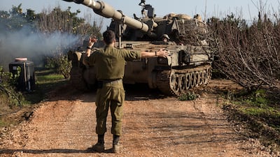 An Israeli soldier directs an artillery unit near the border with Lebanon in Israel. The war between Israel and Hamas has also inflamed tensions on the country's northern border with Lebanon. Getty Images