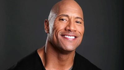 FILE - This March 23, 2013 file photo shows actor Dwayne Johnson posing for a portrait at the Four Seasons in Los Angeles. Johnson also hosts "The Hero," competition series on TNT. The season finale airs Thursday, Aug. 1. (Photo by Eric Charbonneau/Invision/AP, File)