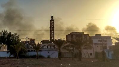 Smoke rises above buildings in southern Khartoum. AFP