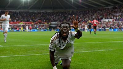 Swansea City striker Bafetimbi Gomis celebrates after scoring the team's second goal against Manchester United on Sunday in their 2-1 victory in the Premier League. Stu Forster / Getty Images