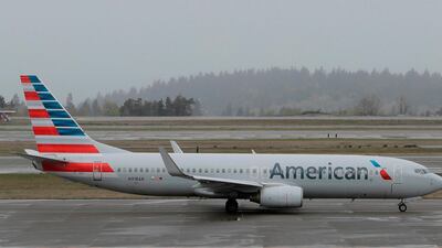 American Airlines reported second-quarter earnings fell to $566 million. AP
