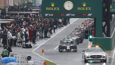 The Japanese Grand Prix began on Sunday behind a safety car due to the rainy conditions at Suzuka Circuit. Toru Hanai / Reuters / October 5, 2014