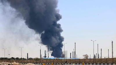 A plume of heavy smoke and fire rise over an oil refinery in southern Tehran, after it was hit in an overnight Israeli strike, on June 15, 2025. Iran fired a fresh barrage of missiles at Israel, state television announced early on June 15, as the rivals exchanged fire for a third day. (Photo by ATTA KENARE / AFP)