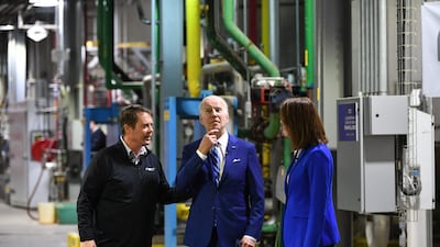 US President Joe Biden (C) speaks with Cindy Axne, US representative. and Jack Mitchell, Regional Vice President, POET Bioprocessing during a visit at the POET Bioprocessing plant in Menlo, Iowa. AFP
