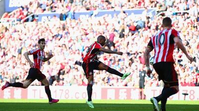 Jermain Defoe of Sunderland shoots and scores the winner against Newcastle United on Sunday in a 1-0 Premier League victory at the Stadium of Light. Matthew Lewis / Getty Images / April 5, 2015