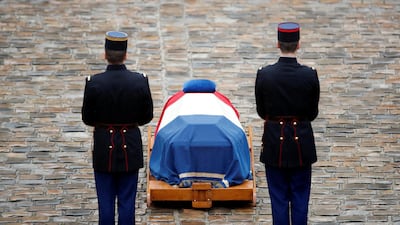 French Republican guards stand in front of the flag-draped coffin of late Gendarmerie officer Col Arnaud Beltrame. Christian Hartmann / Reuters