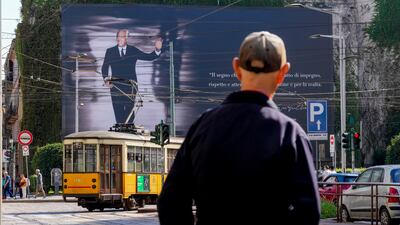 In Milan, Italy, a giant poster commemorates the life of fashion designer Giorgio Armani, who died on Thursday September 4 at the age of 91. AP
