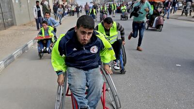 Palestinian handicapped take part in a marathon calling for opening Gaza crossing with outside world, in Khan Younis in the southern Gaza Strip. Reuters