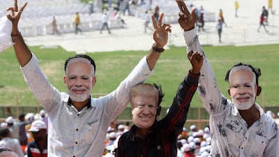 Indian people wears mask of Indian Prime Minister Narendra Modi and US President Donald Trump, at the Sardar Patel Stadium, where US President Donald Trump will deliver a speech, in Ahmedabad, India. EPA
