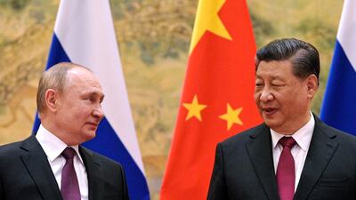 Chinese President Xi Jinping, right, and Russian President Vladimir Putin meet in Beijing on February 4 last year. China's diplomacy is becoming more visible, growing in tandem with its economic influence. AP