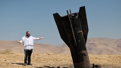 A missile protruding from the ground, after air strikes from Iran, in the Israeli-occupied West Bank. Reuters
